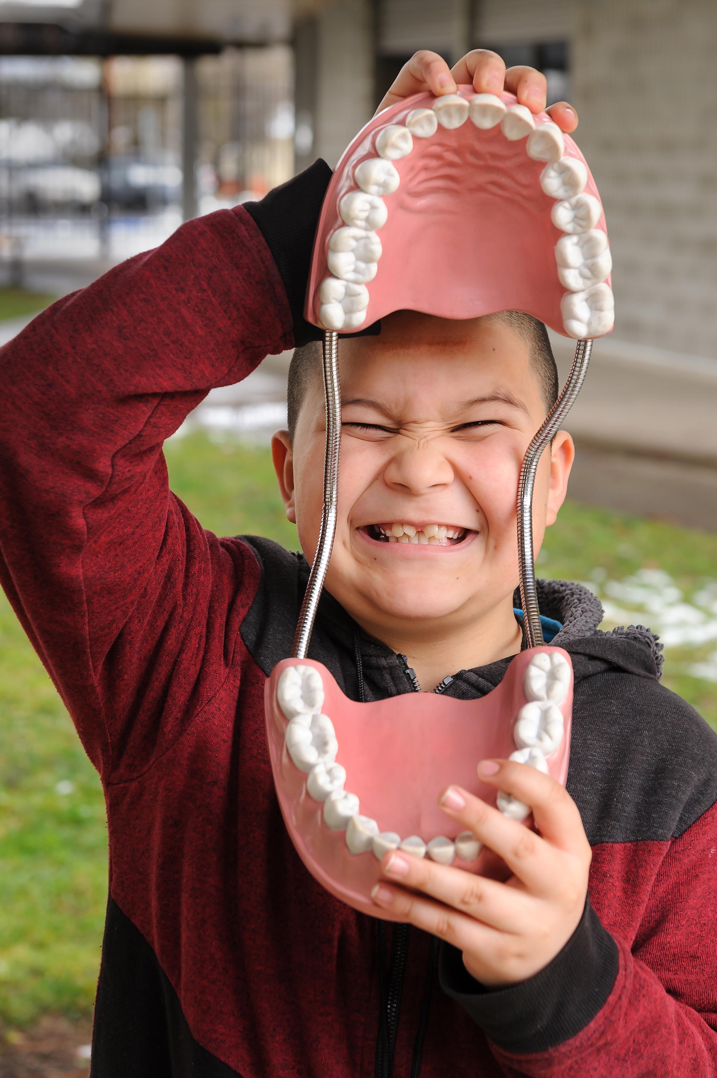 Allen's mouth is healthy and cavity-free a year after he started care.