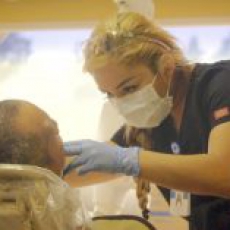 Employees provide care for dental emergencies as part of the mobile service.