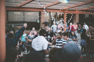 people celebrate together on patio